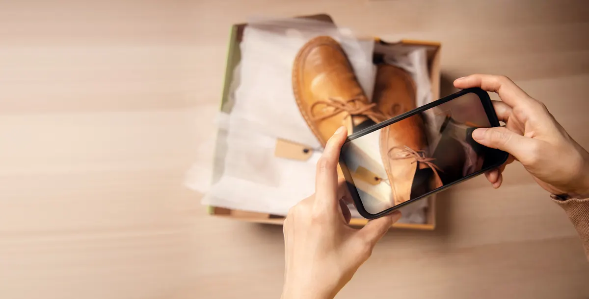 Ecommerce reviews and ratings: customer Experiences Concepts. Customer Unboxing and Taking Photo of her New Shoes for Review, Feedback and Satisfaction. Using Mobile Phone to Selling Online Products.