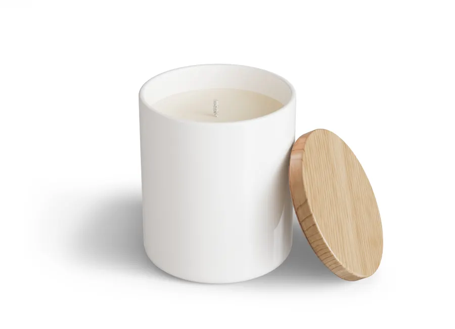 Scented candle in a glass jar on a plain background, shown as an add-on in a sample store card