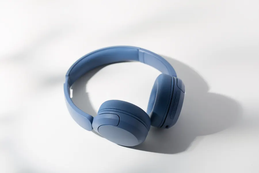 Over-ear headphones on a plain background, shown as a repeat order in a sample store card