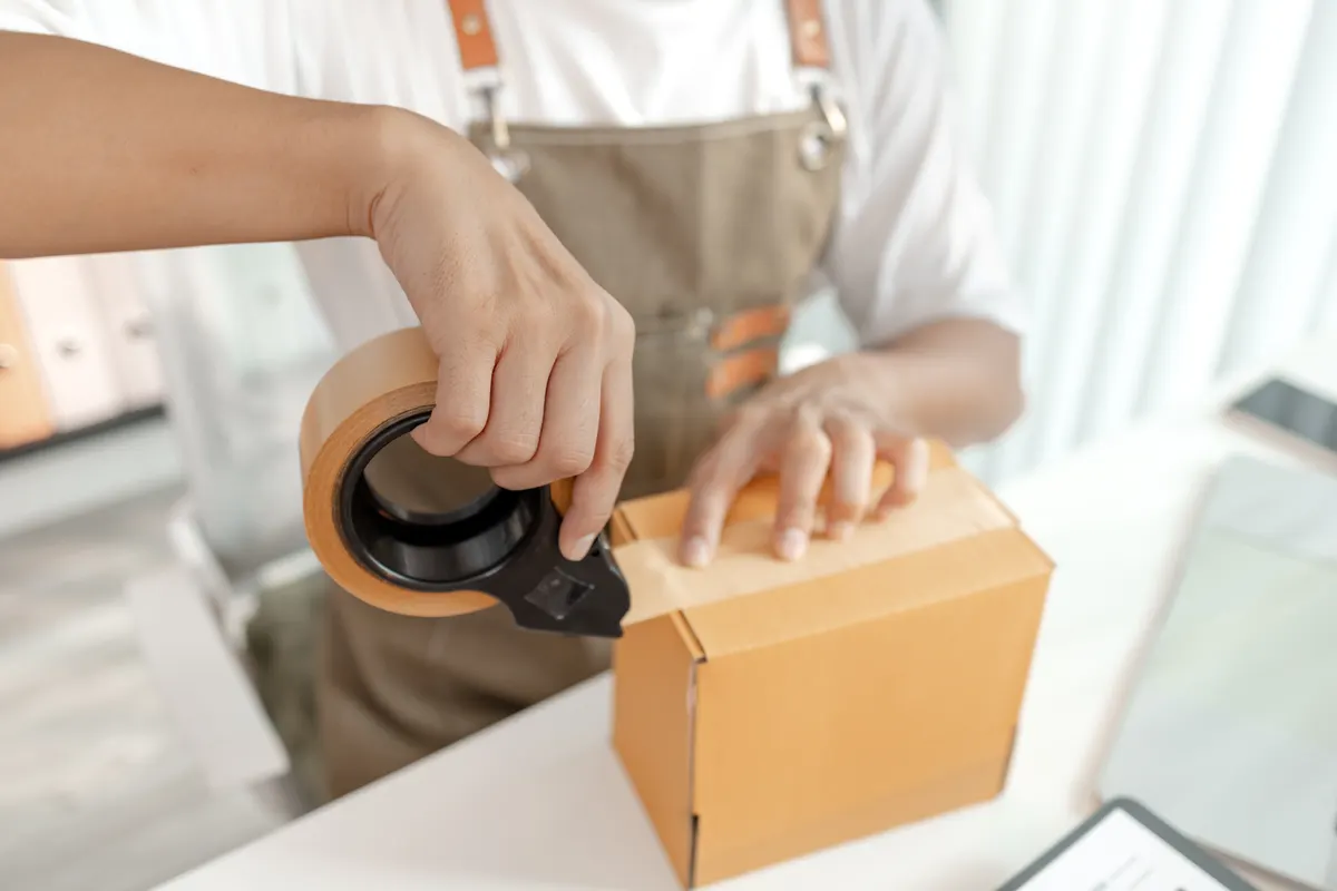 Packaging as a repeat-purchase lever: small business entrepreneur in ecommerce startup, showcasing online retail, packaging process, digital transformation, and innovative trade solutions for global marketplace success.