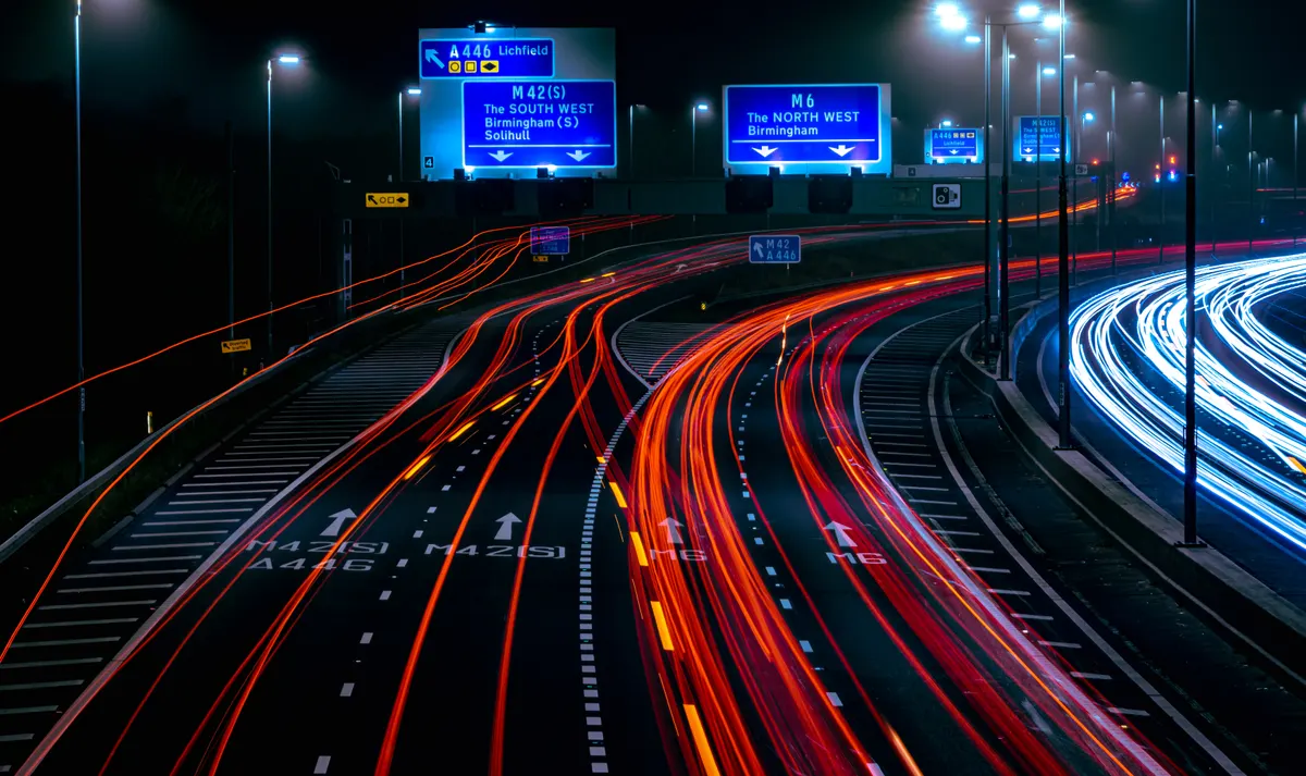 Why we fix conversion before traffic: motorway traffic light trails at a busy junction.