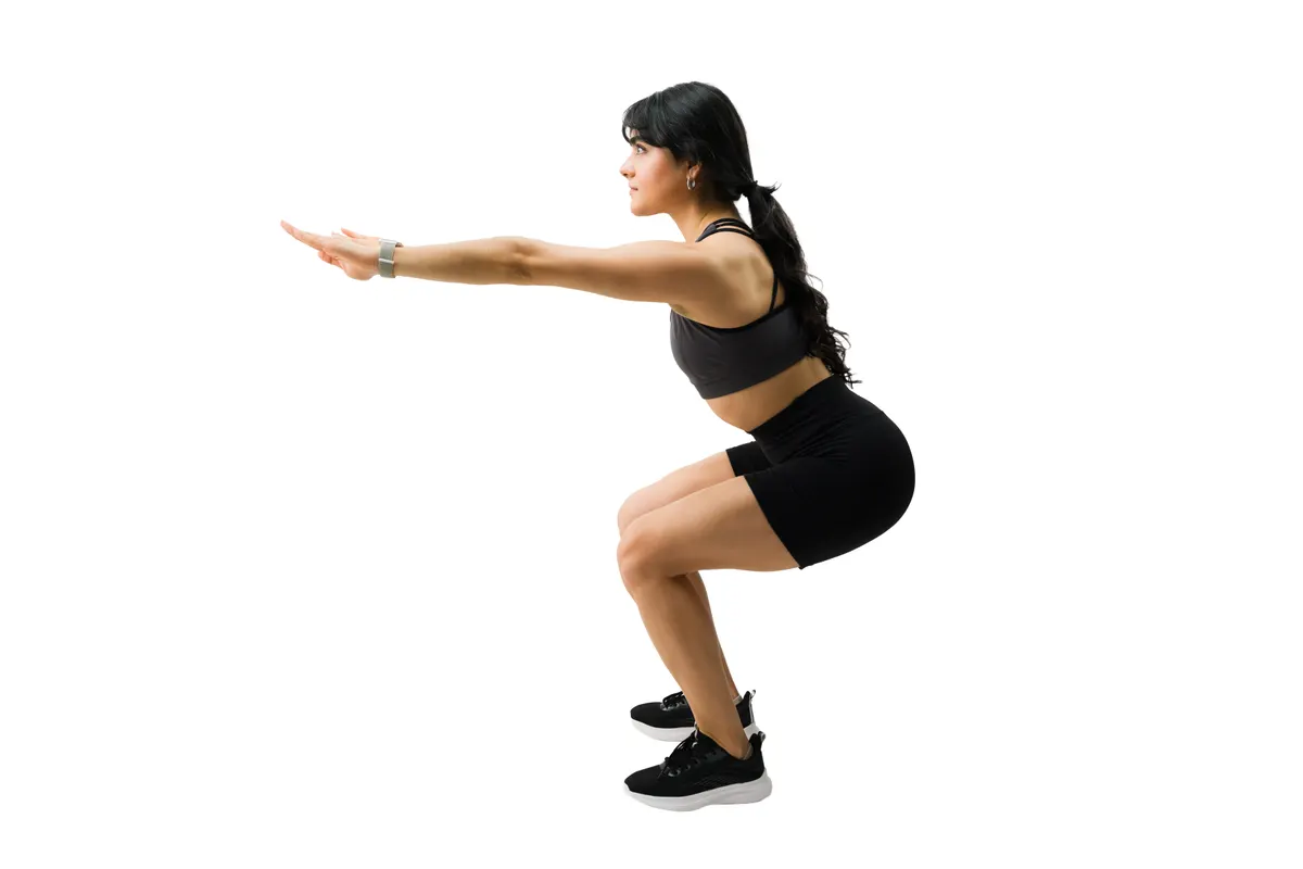 Activewear marketing agency: young athletic woman doing squats, exercising and training for strength and healthy lifestyle. Fitness concept.