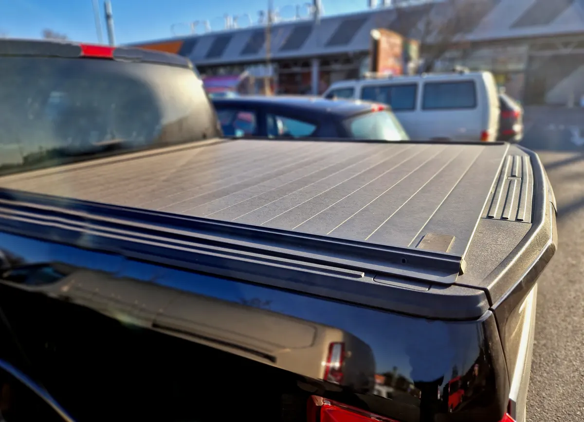 Truck accessory marketing agency: cover with tail gate locking system designed to fit all standard vehicle security accessory offering a quick and easy way to safely lock away your load.