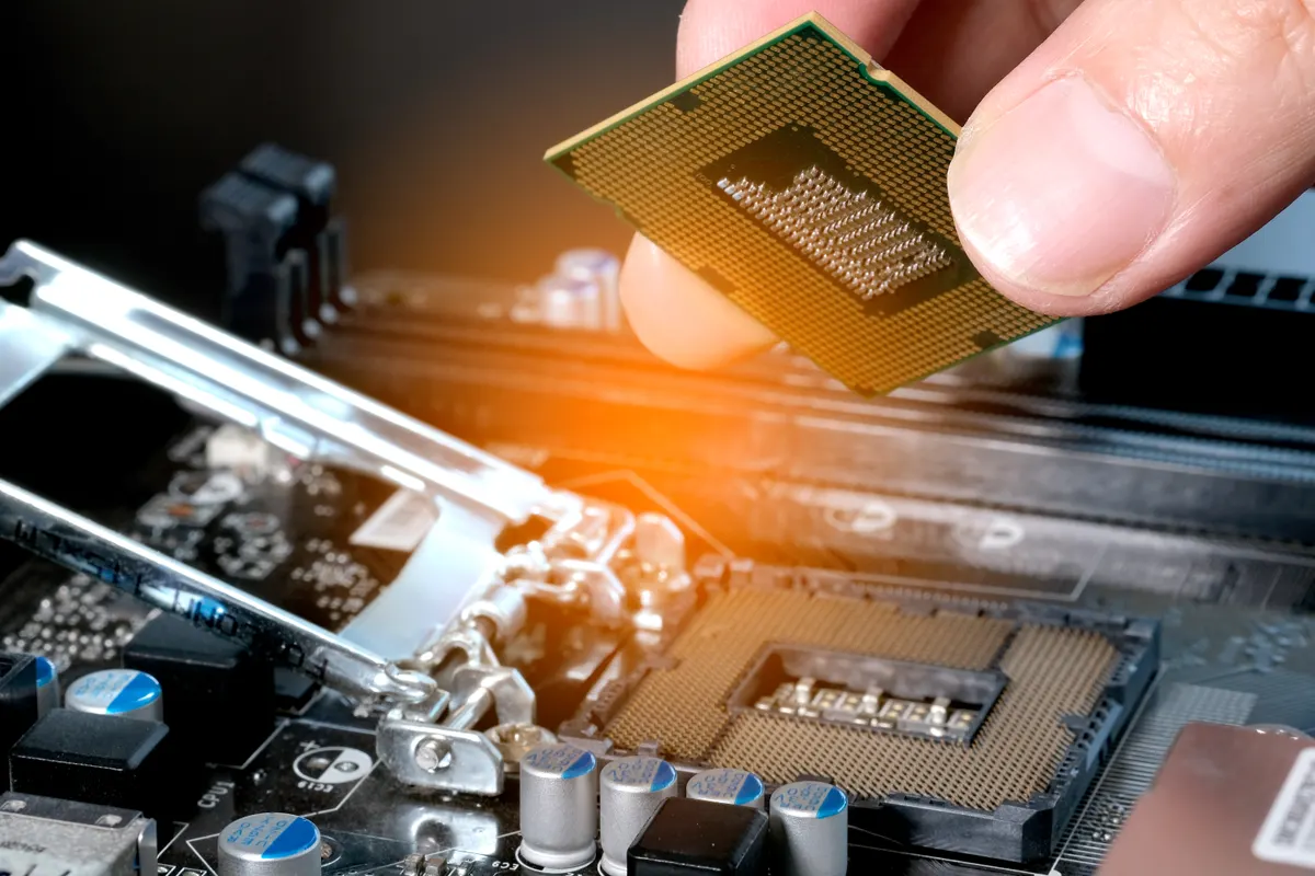 PC component marketing agency: hand of computer engineering brings computer cpu processor memory change components into socket processor for maintenance.Technology and development concept.