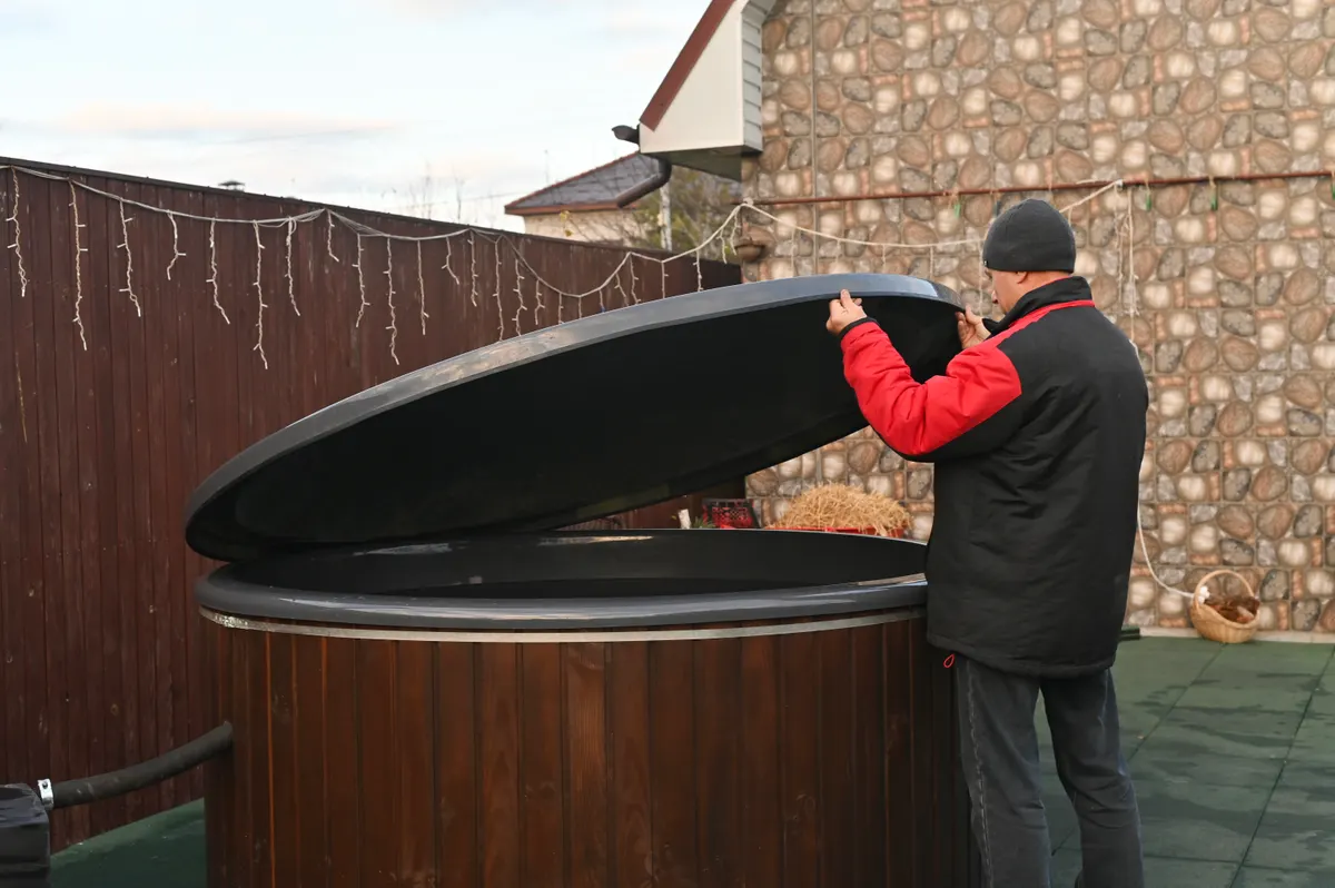 Hot tub & sauna marketing agency: backyard hot tub features wood fired stove for heating.
