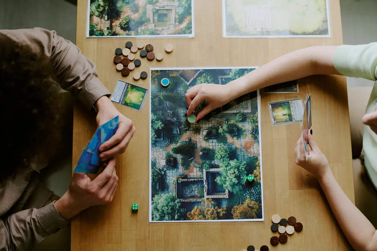 Board game marketing agency: unrecognizable Couple Playing Board Game.
