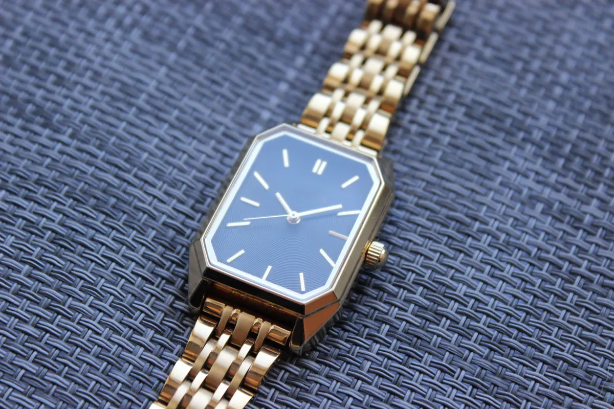 Fine jewelry marketing agency: gold Watch Case Macro with Blue Dial.
