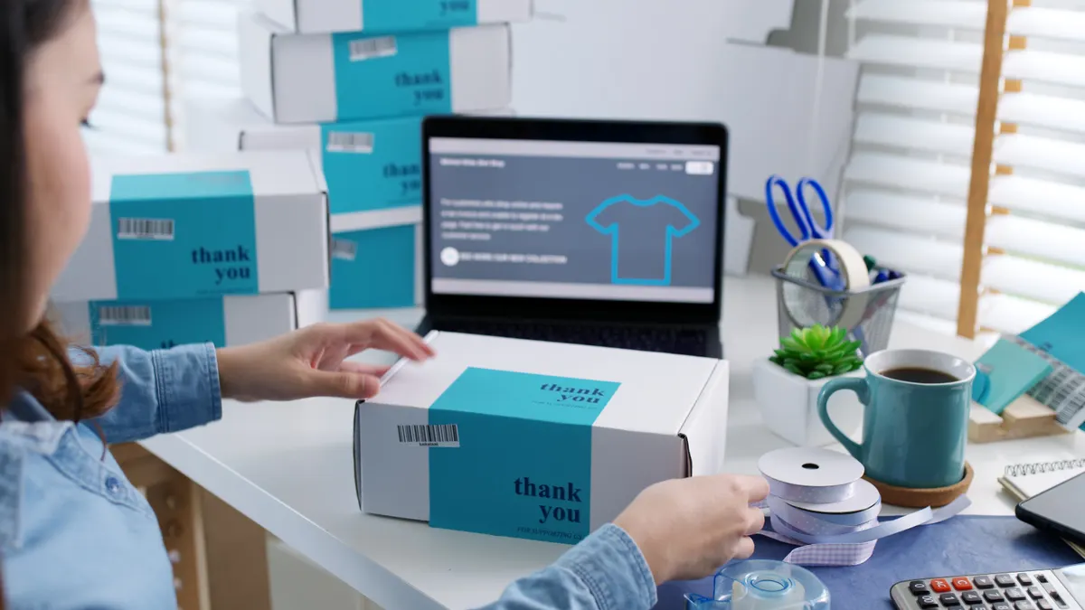 Dropshipping marketing agency: young attractive beautiful hipster asia female packing product small business parcel order online retail store for delivery to customer. SME owner work preparing dropshipping box at home office.