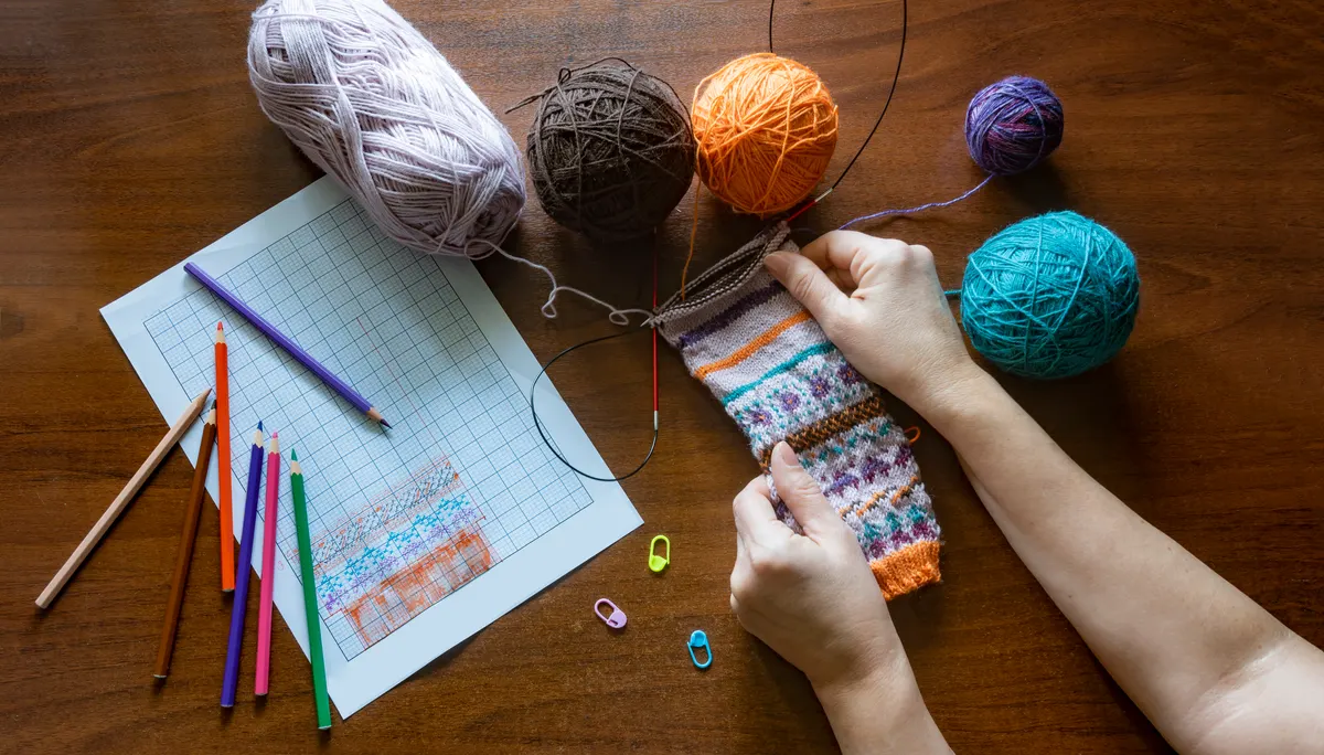 Craft subscription marketing agency: hands Knitting Fair Isle Sock.